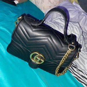 Woman’s Black Guccis bag